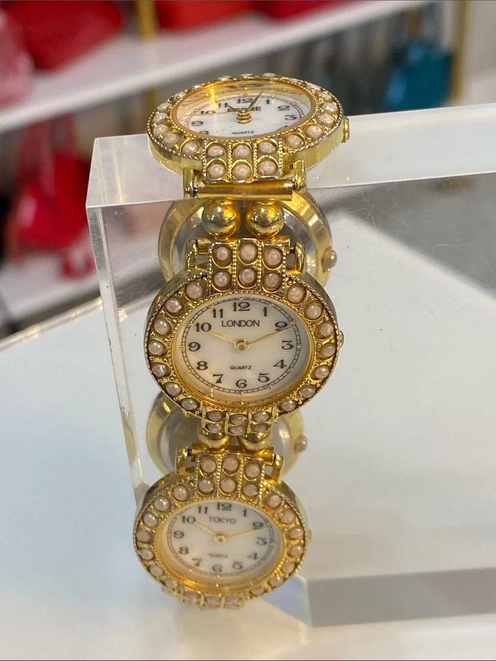 Faux pearl gold tone watch